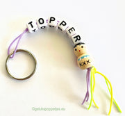 Keyring topper with wooden lucky doll