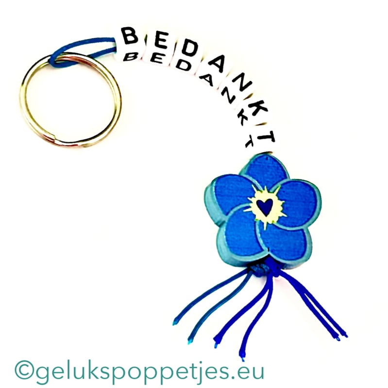 Sleutelhanger bedankt met gelukspoppetje vergeet me nietje