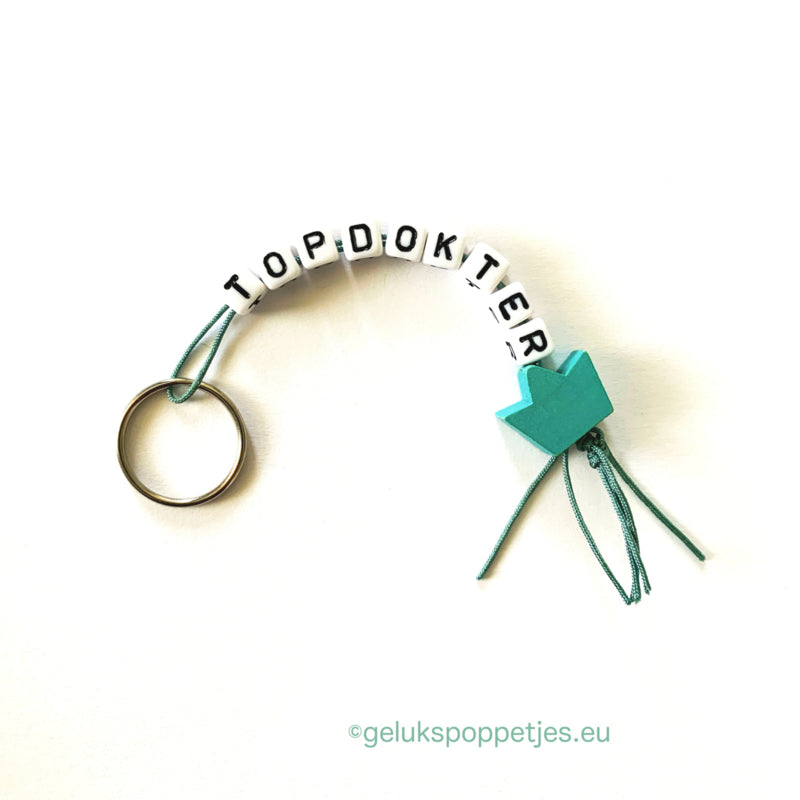 Keyring top doctor with lucky doll crown