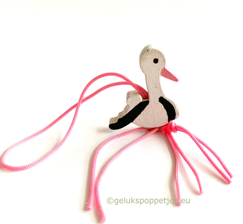 Pink stork lucky charm