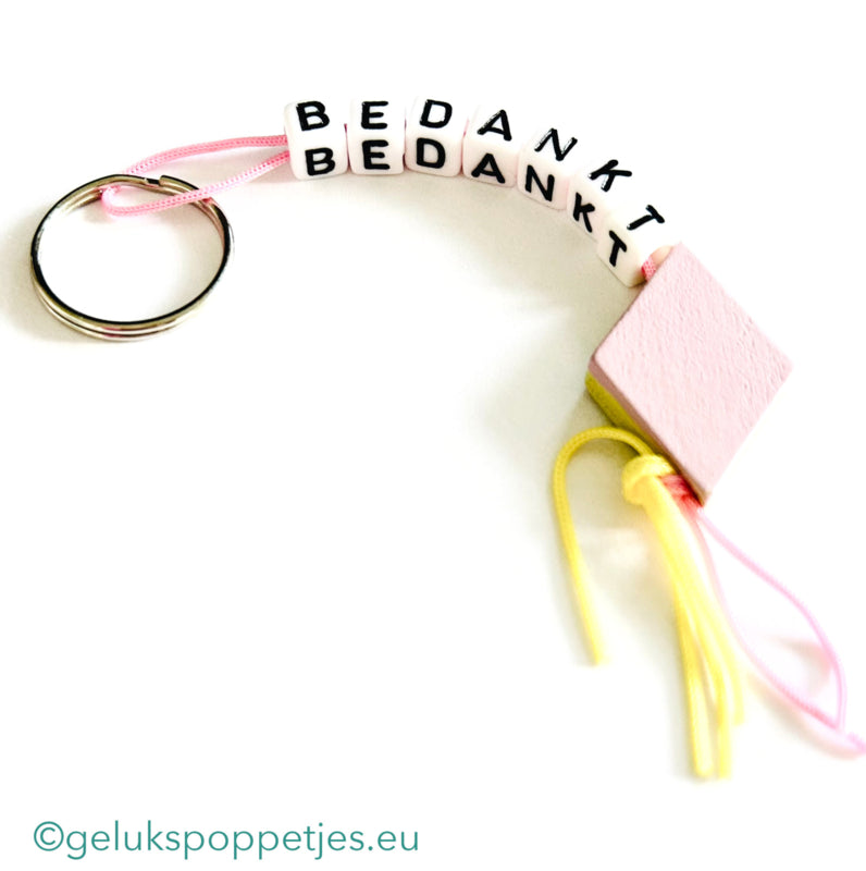 Sleutelhanger bedankt sich mit gelukspoppetje spekje