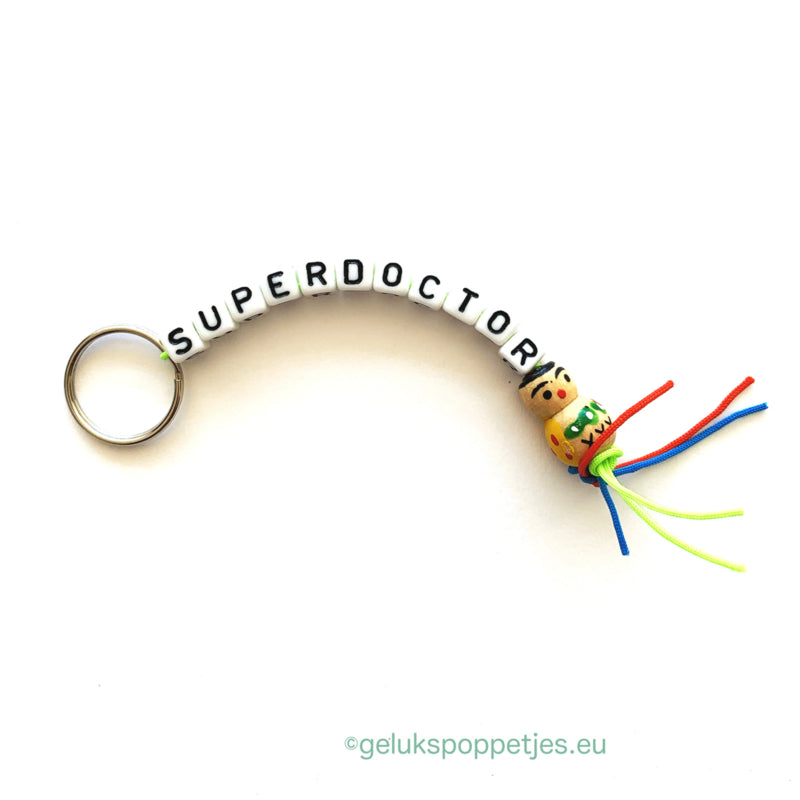 Superdoctor keychain with wooden lucky charm