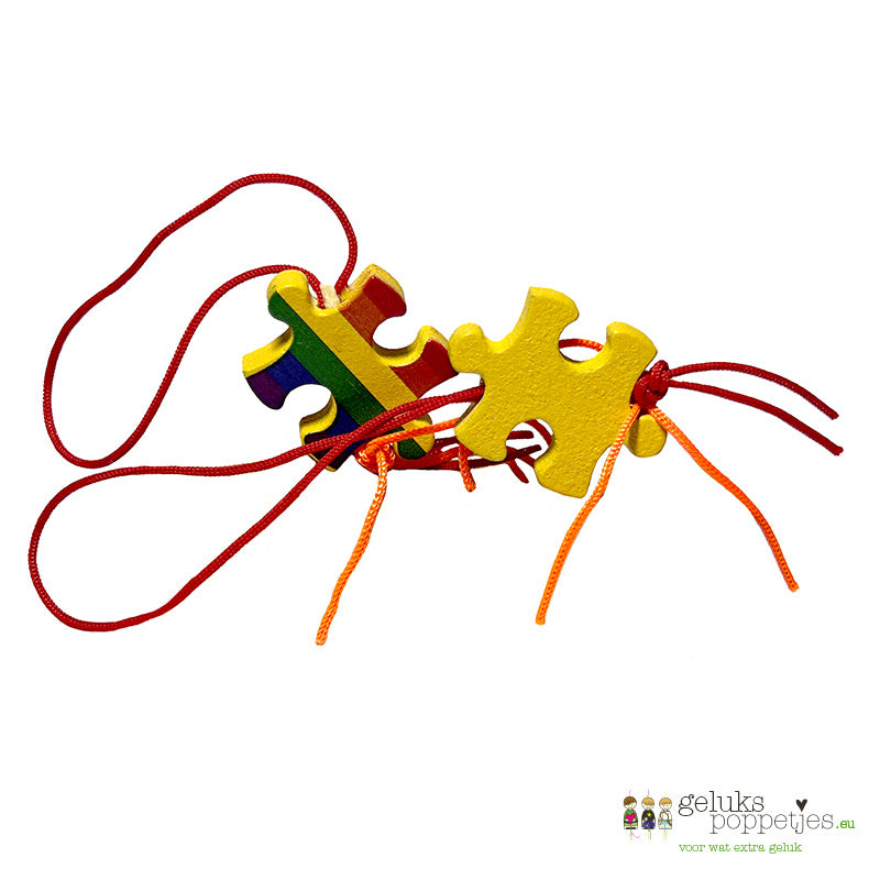 Gelukspoppetje puzzelstukje