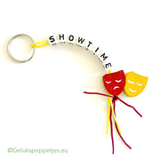 Showtime keychain with lucky charm and theater masks