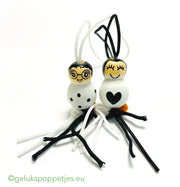 Gelukspoppetje met stipjes of hartje