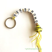 Bee-strong keychain with lucky bee doll