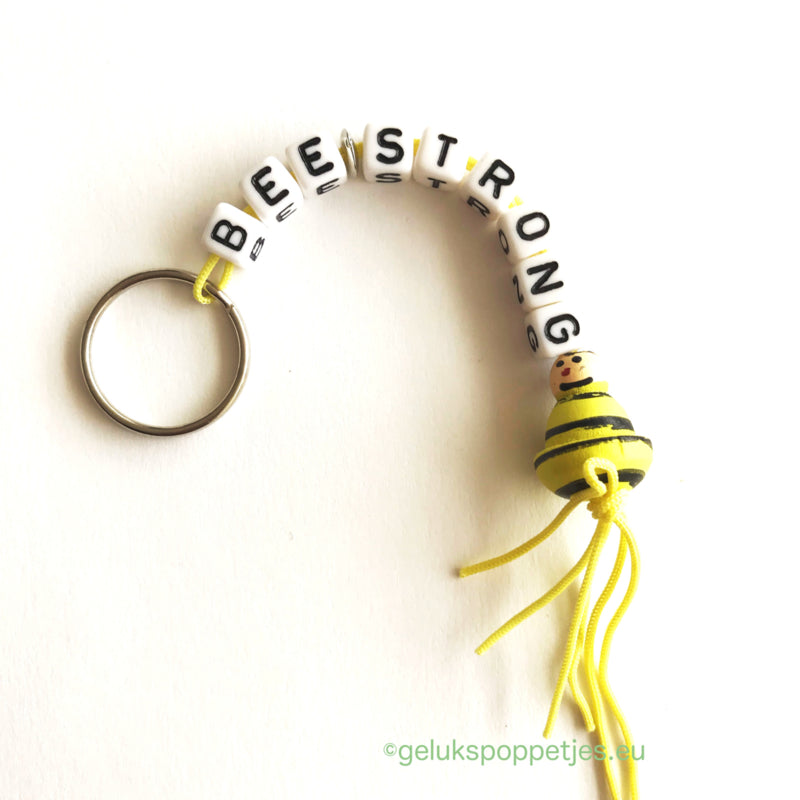 Bee-strong keychain with lucky bee doll