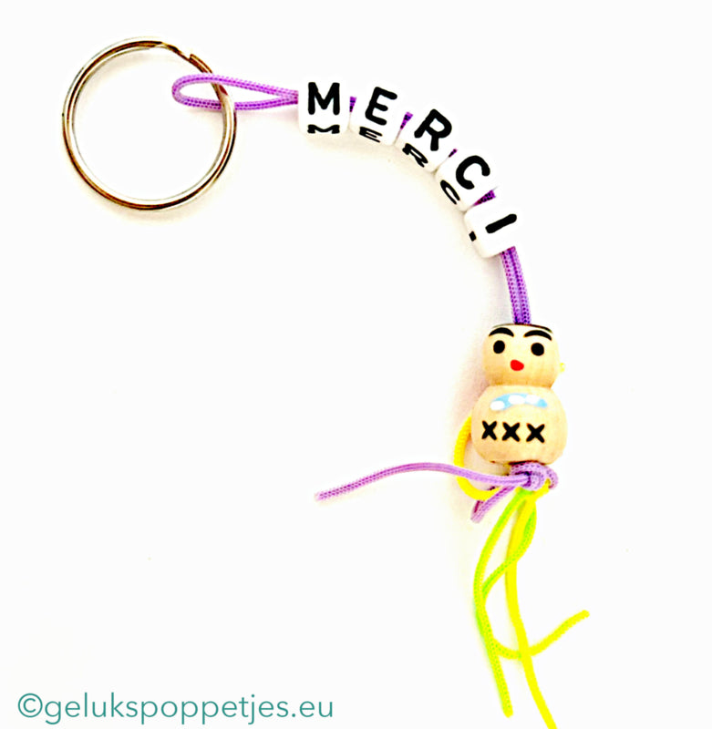 Merci keychain with wooden lucky charm