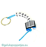 Sleutelhanger danke mit gelukspoppetje boekje